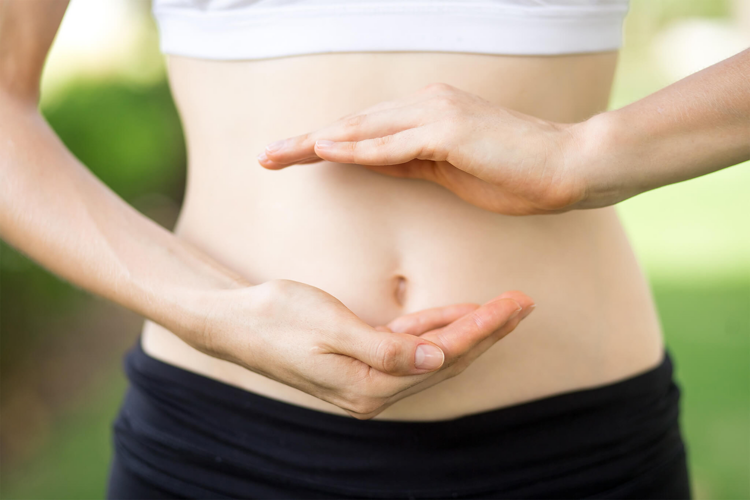 Close up of young woman's hands with slim body