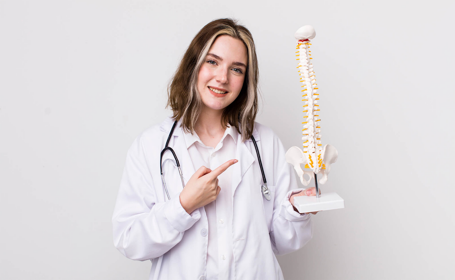 Doctor pointing to backbone structure